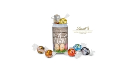 Geschenkartikel / Präsentartikel: Lindt-Geheimnis Ostern - Etikett Frohe Ostern - EierHasen